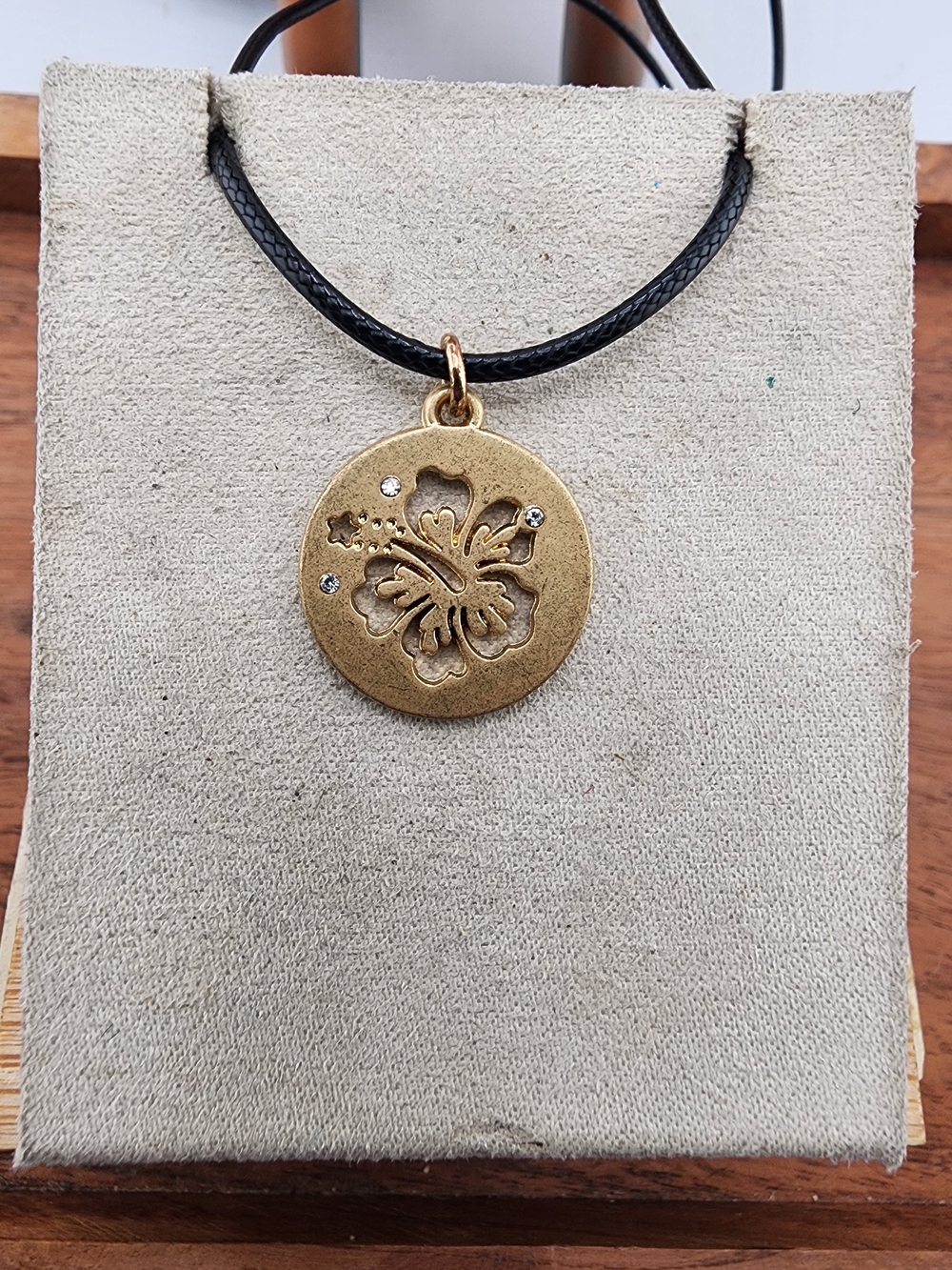 Gold Tone Hibiscus Pendant Necklace with Black Cord